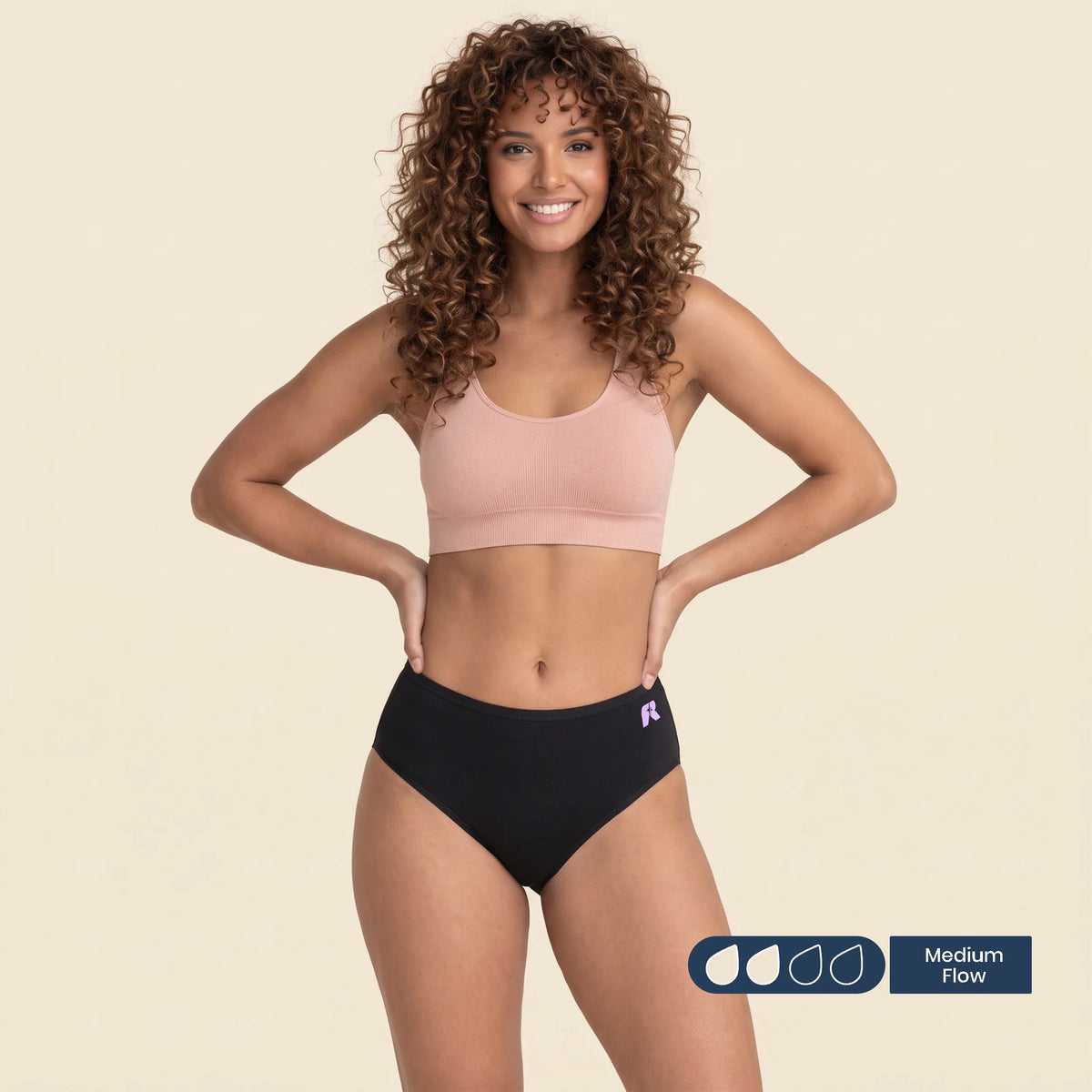 Woman wearing FreeFlowa black mid-brief period underwear