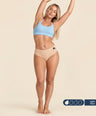 Woman wearing FreeFlowa peach mid-brief period underwear