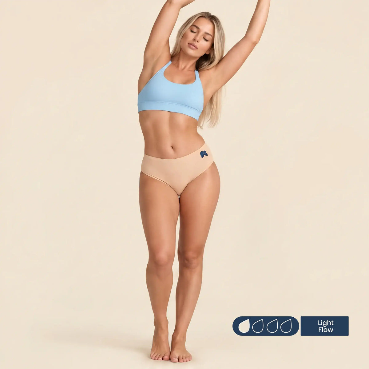Woman wearing FreeFlowa peach mid-brief period underwear